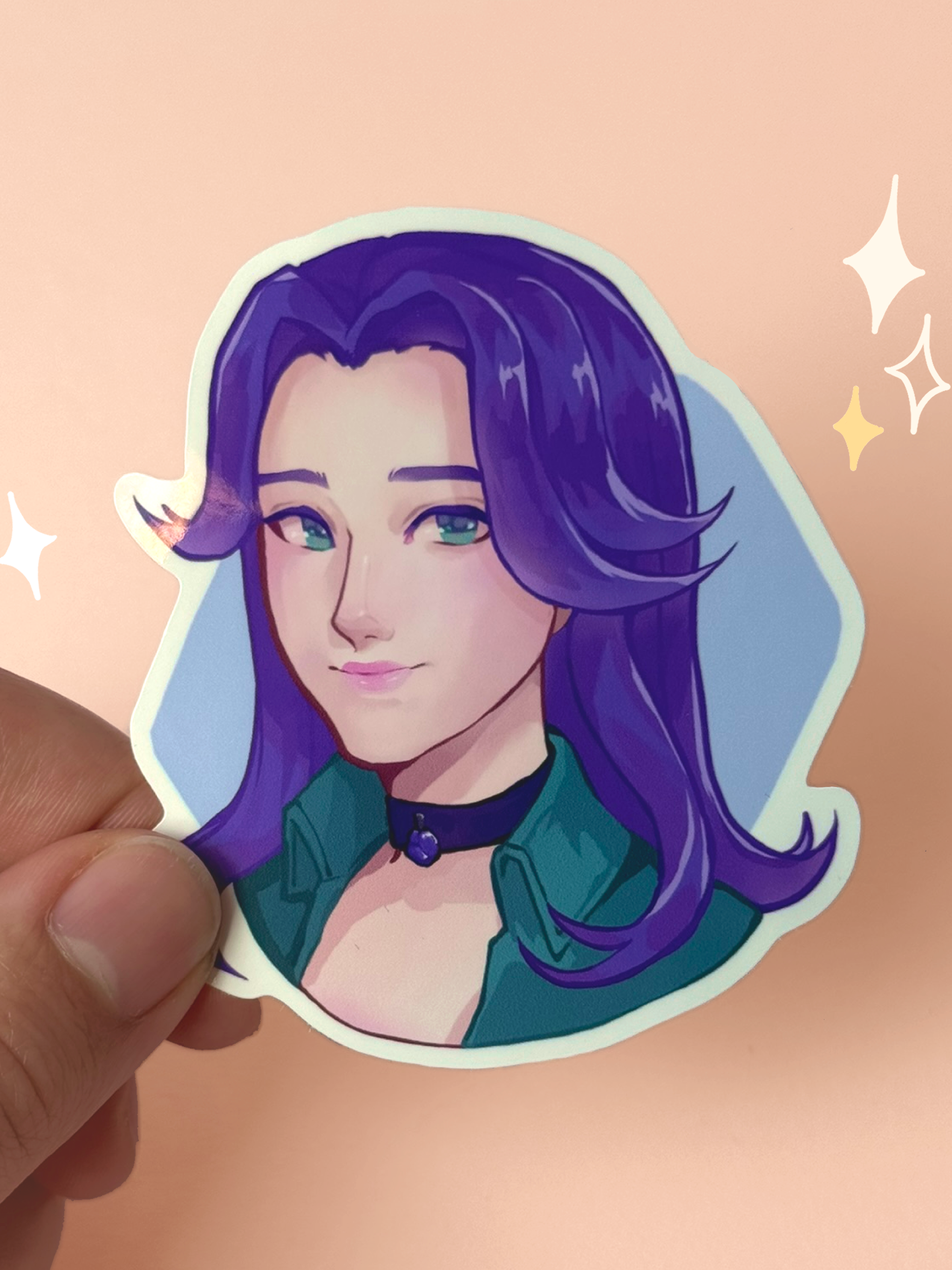 Die-cut vinyl sticker of Abigail from Stardew Valley, with long purple hair, green eyes, a black choker with a purple gem, and a teal jacket, smiling softly on a blue background, held between fingers against a peach background.
