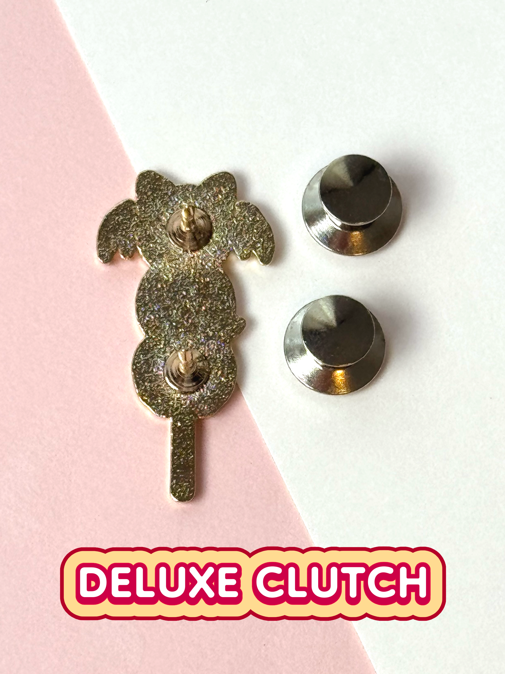 The Halloween mochi pin comes with two deluxe clutches