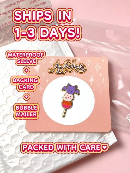 The Halloween mochi pin ships in 1 to 3 days in a waterproof sleeve, backing card, and bubble mailer