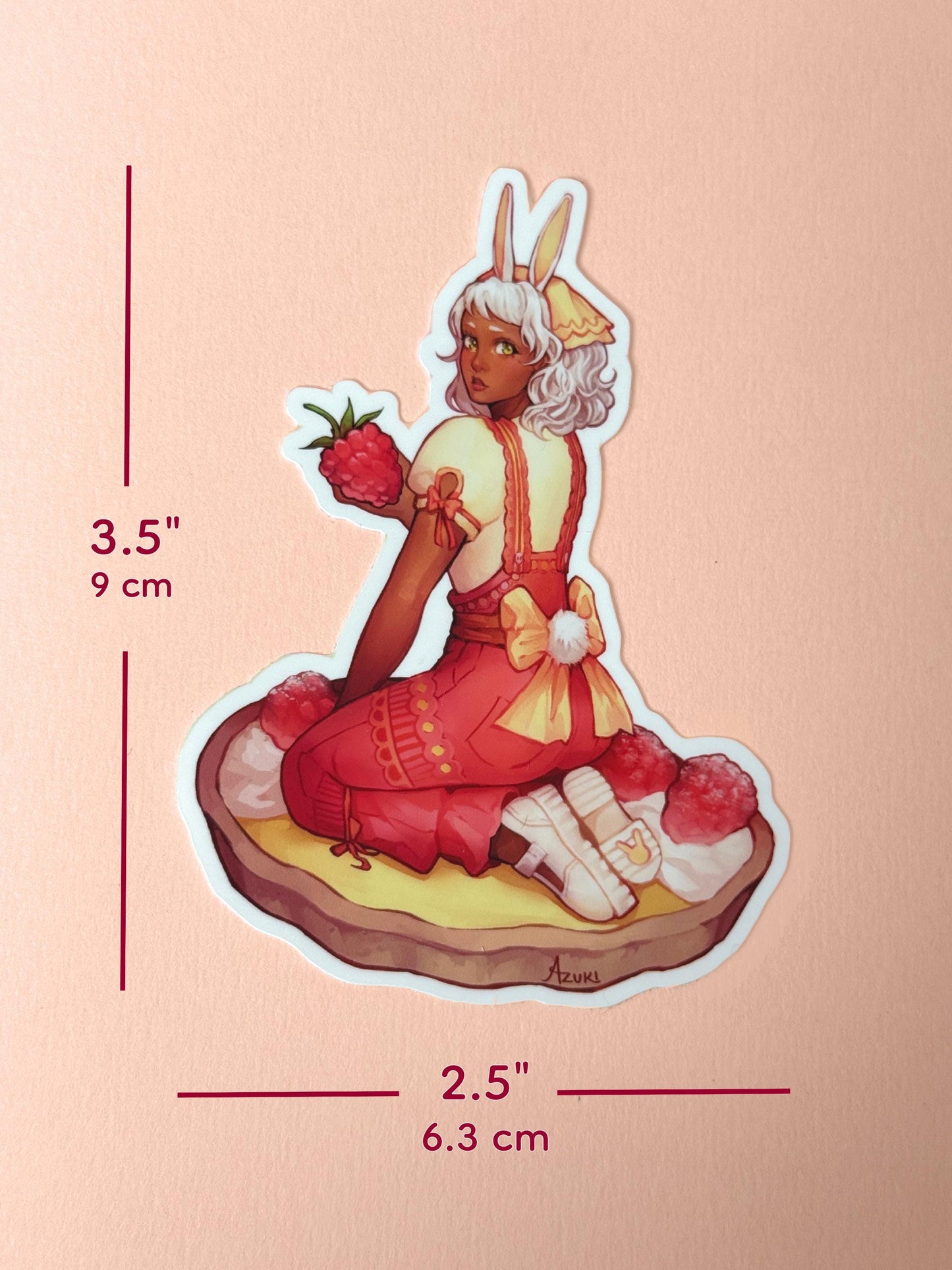 The lemon raspberry tart bunny girl sticker measures 3.5 inches tall and 2.5 inches wide.