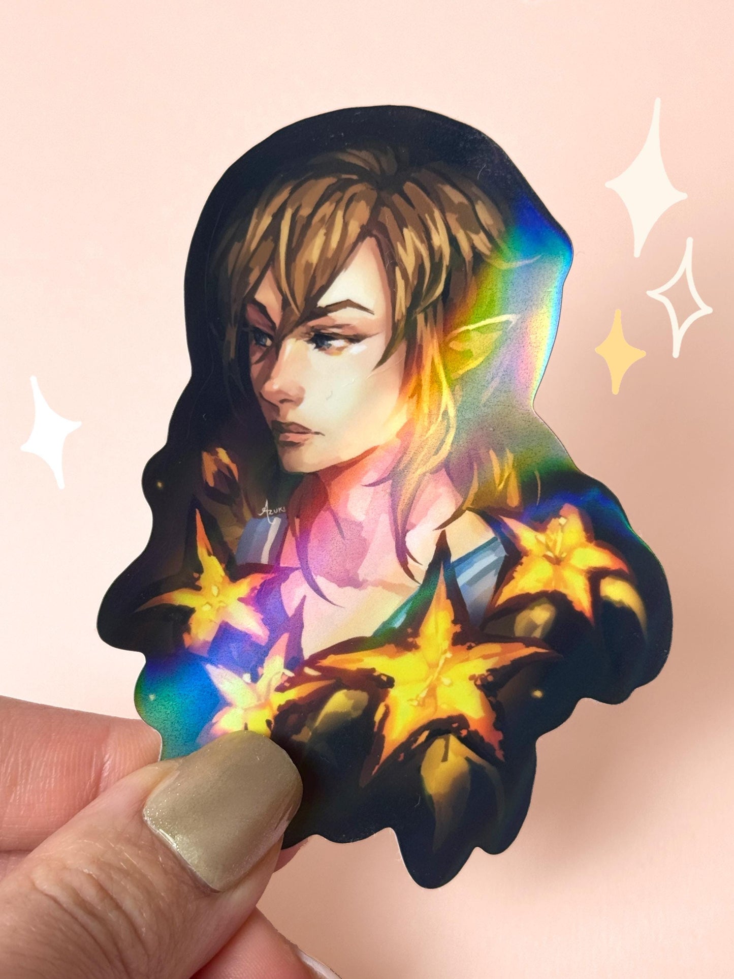 Die-cut holographic vinyl sticker of Link from The Legend of Zelda: Tears of the Kingdom, in profile with golden Sundelion flowers glowing around him on a dark background, held between fingers against a peach background.