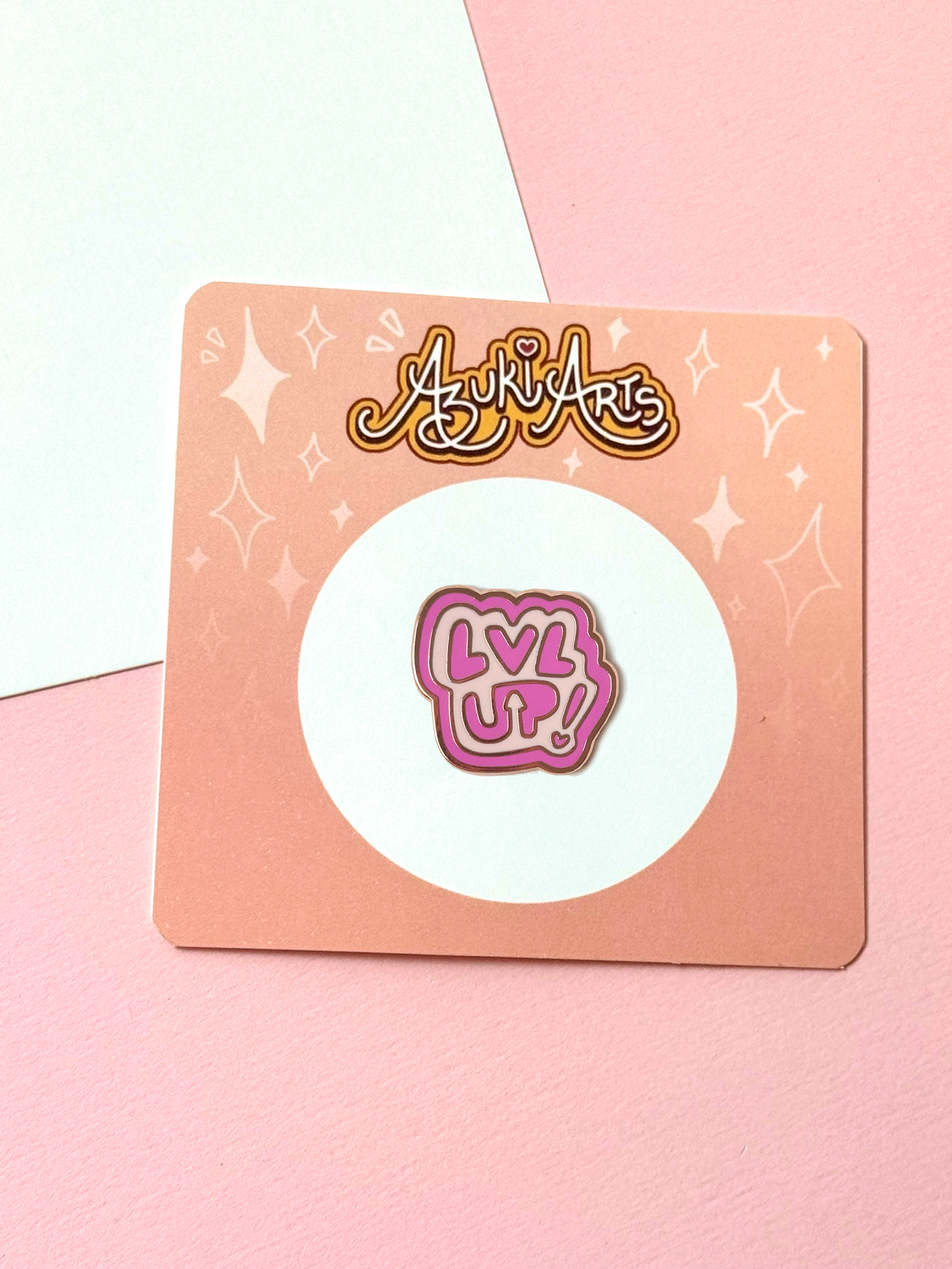 The LVL UP pin with its backing card.