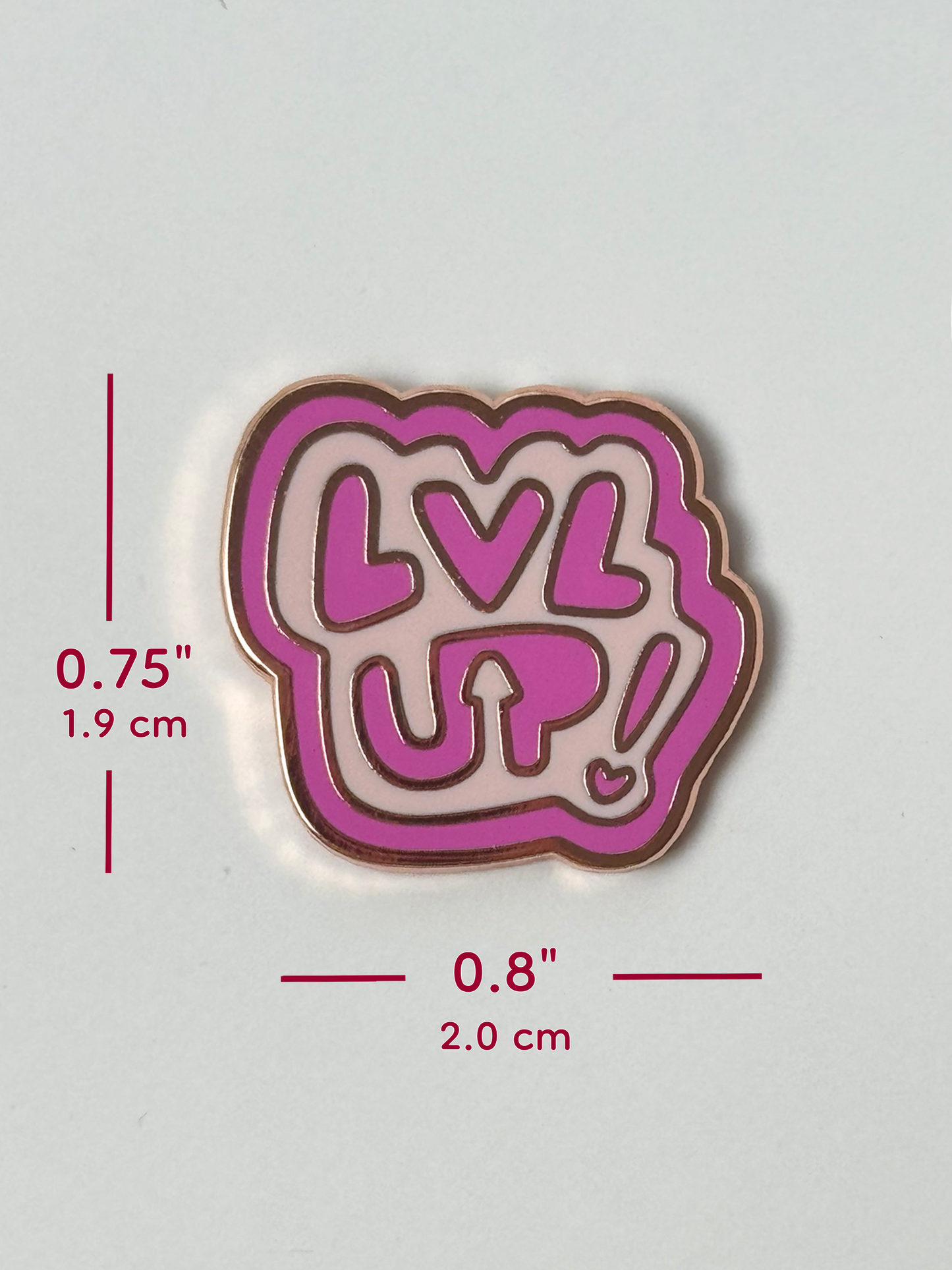 The LVL UP pin measures 0.75 inches tall and 0.8 inches wide.