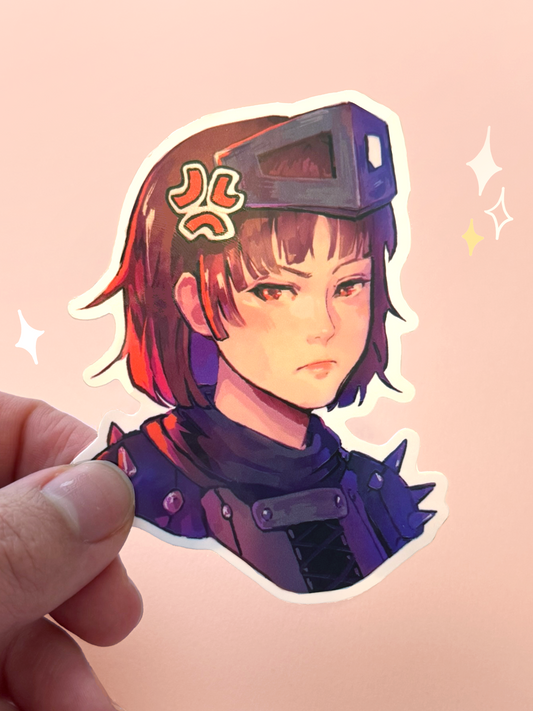 Die-cut vinyl sticker of Makoto Niijima (Queen) from Persona 5 Royal, wearing her Phantom Thief armor and metal visor pushed up over short brown hair, with a serious expression, held between fingers against a peach background.