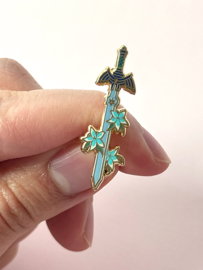 The master sword pin held in hand.