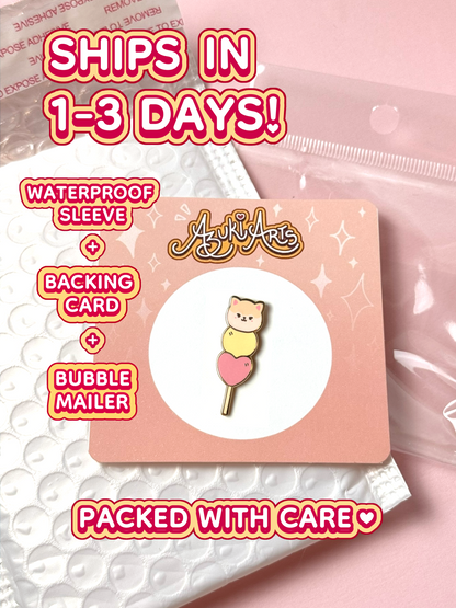 The May mochi pin ships in 1 to 3 days in a waterproof sleeve, backing card, and bubble mailer.