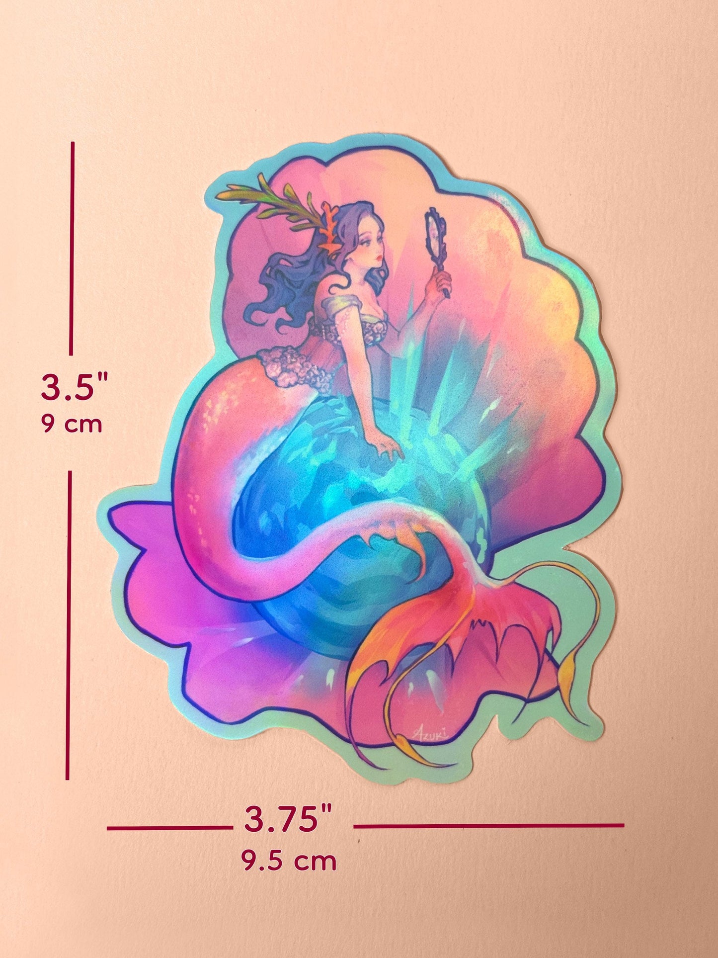The mirror mermaid measures 3.5 inches tall and 3.75 inches wide.