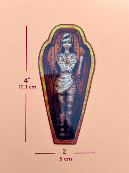 The mummy coffin girl sticker is 4 inches tall and 2 inches wide.