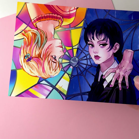 This video highlights the Wednesday and Enid print in different lighting.