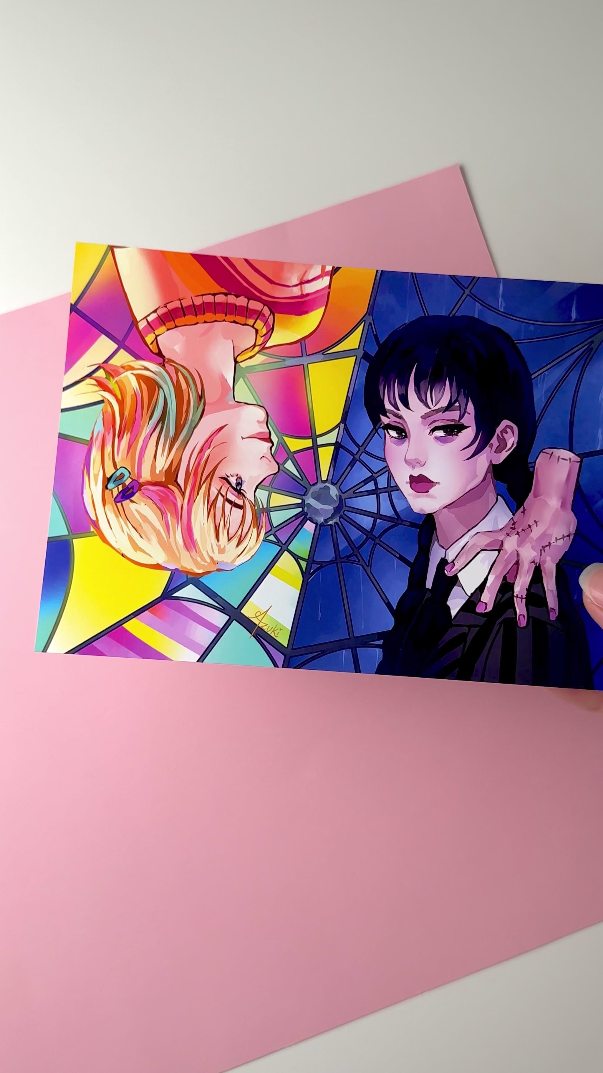 This video highlights the Wednesday and Enid print in different lighting.