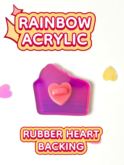 The rainbow cake pin has a rubber heart backing