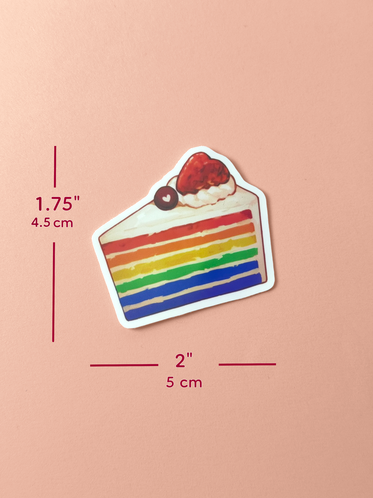 The rainbow cake sticker measures 1.75 inches tall and 2 inches wide.