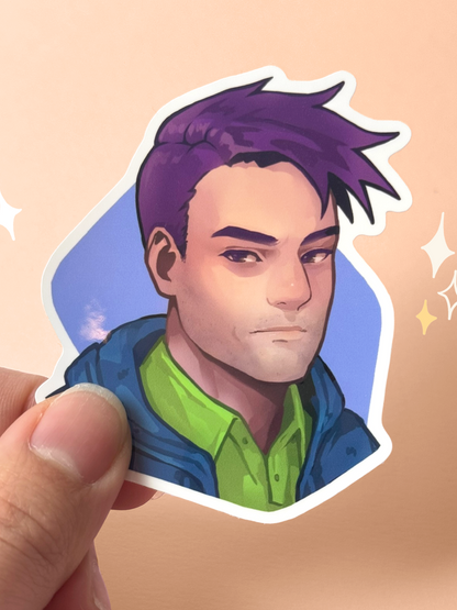 Die-cut vinyl sticker of Shane from Stardew Valley, with short purple hair, a blue jacket over a green hoodie, a slight smirk, on a blue background, held between fingers against a peach background.
