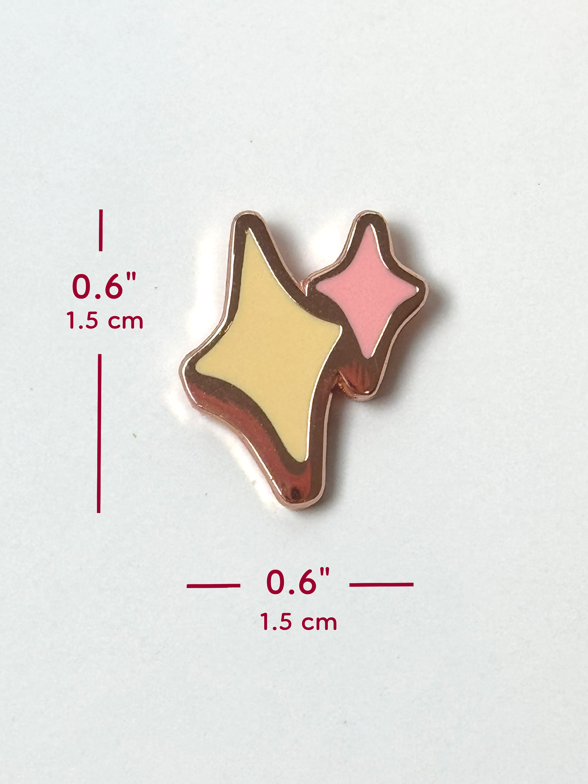The sparkles pin measures 0.6 inches tall and 0.6 inches wide