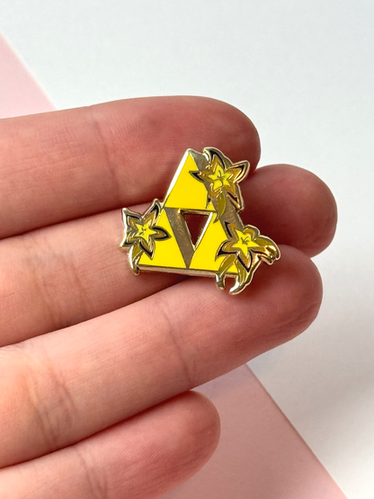 The triforce pin held in hand