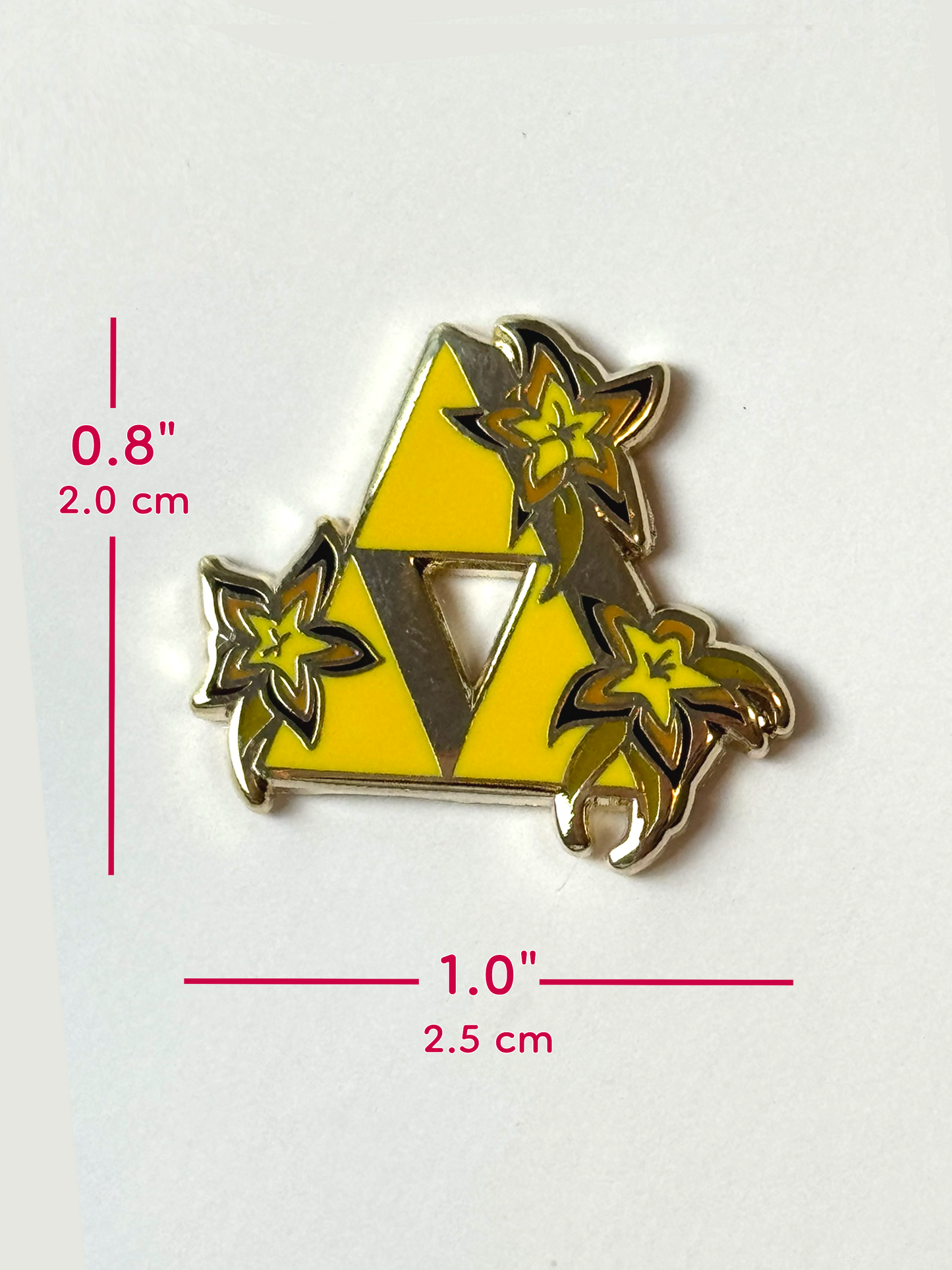 The triforce pin measures 0.8 inches tall or 1 inches wide.
