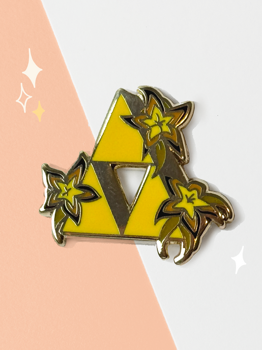 Gold-lined hard enamel pin of the Triforce from The Legend of Zelda in bright yellow, wrapped with glowing golden Sundelion flowers, on a peach and white background.