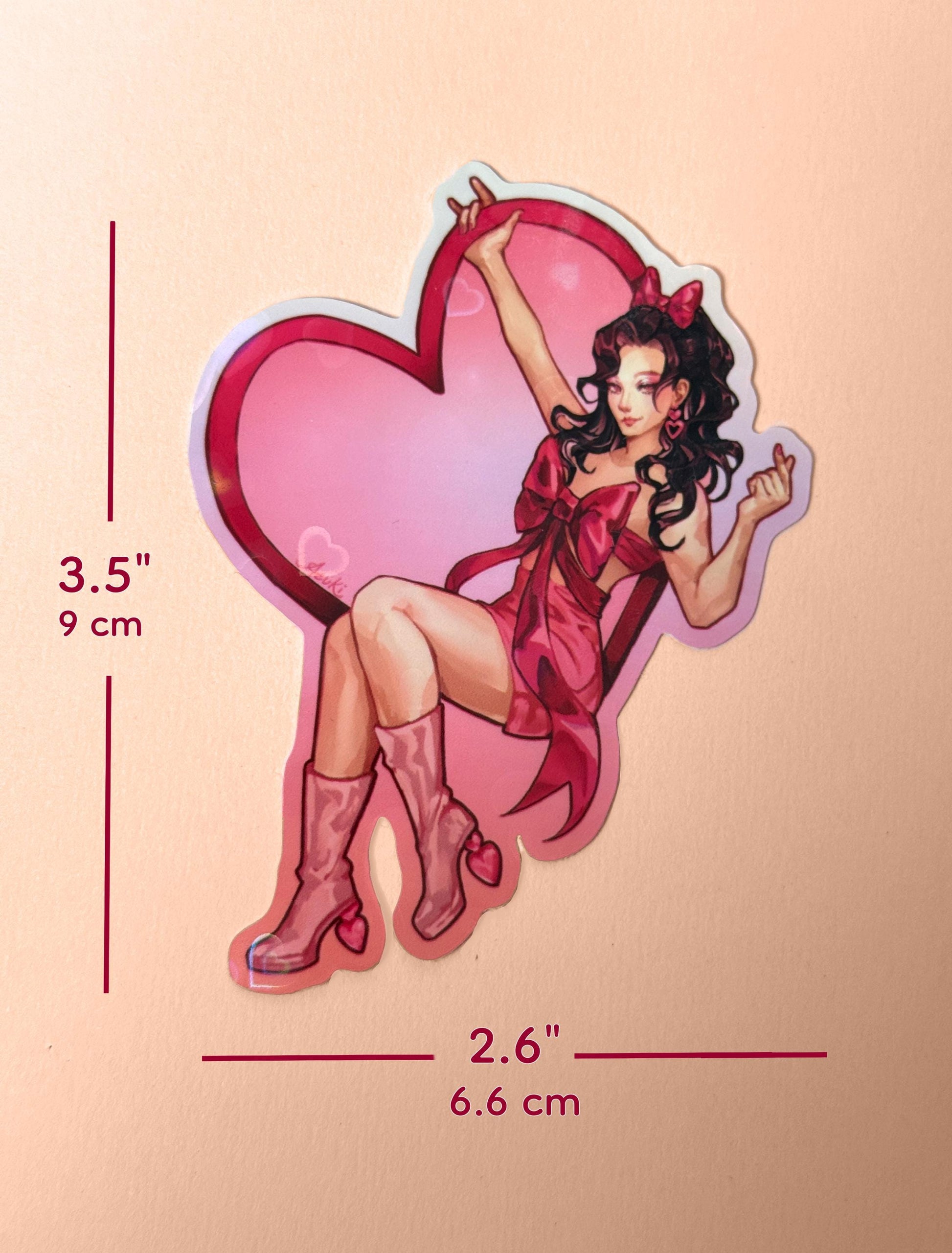The Valentines Day girl sticker measures 3.5 inches tall and 2.6 inches wide.