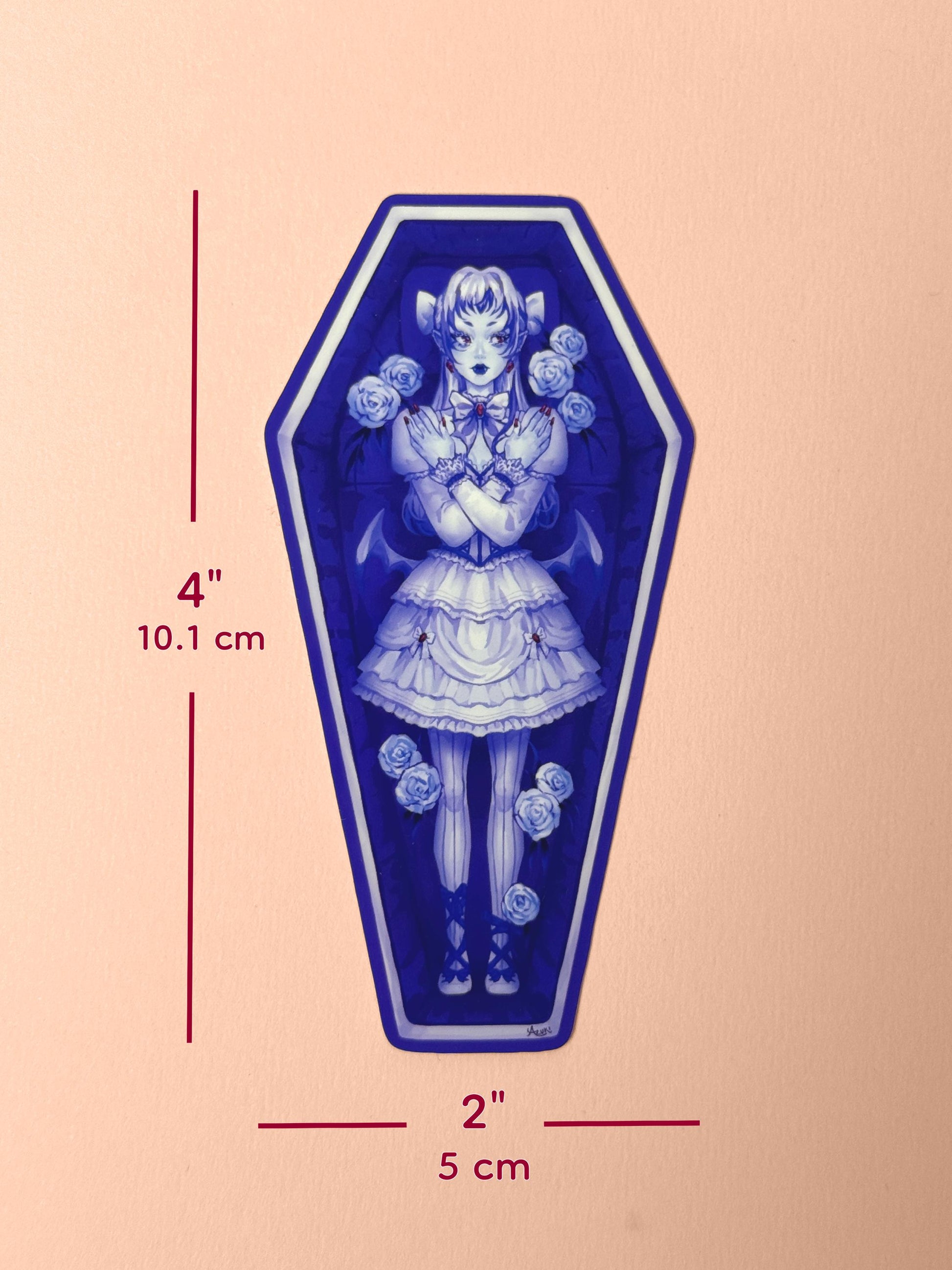 The vampire coffin girl sticker measures 4 inches tall and 2 inches wide.