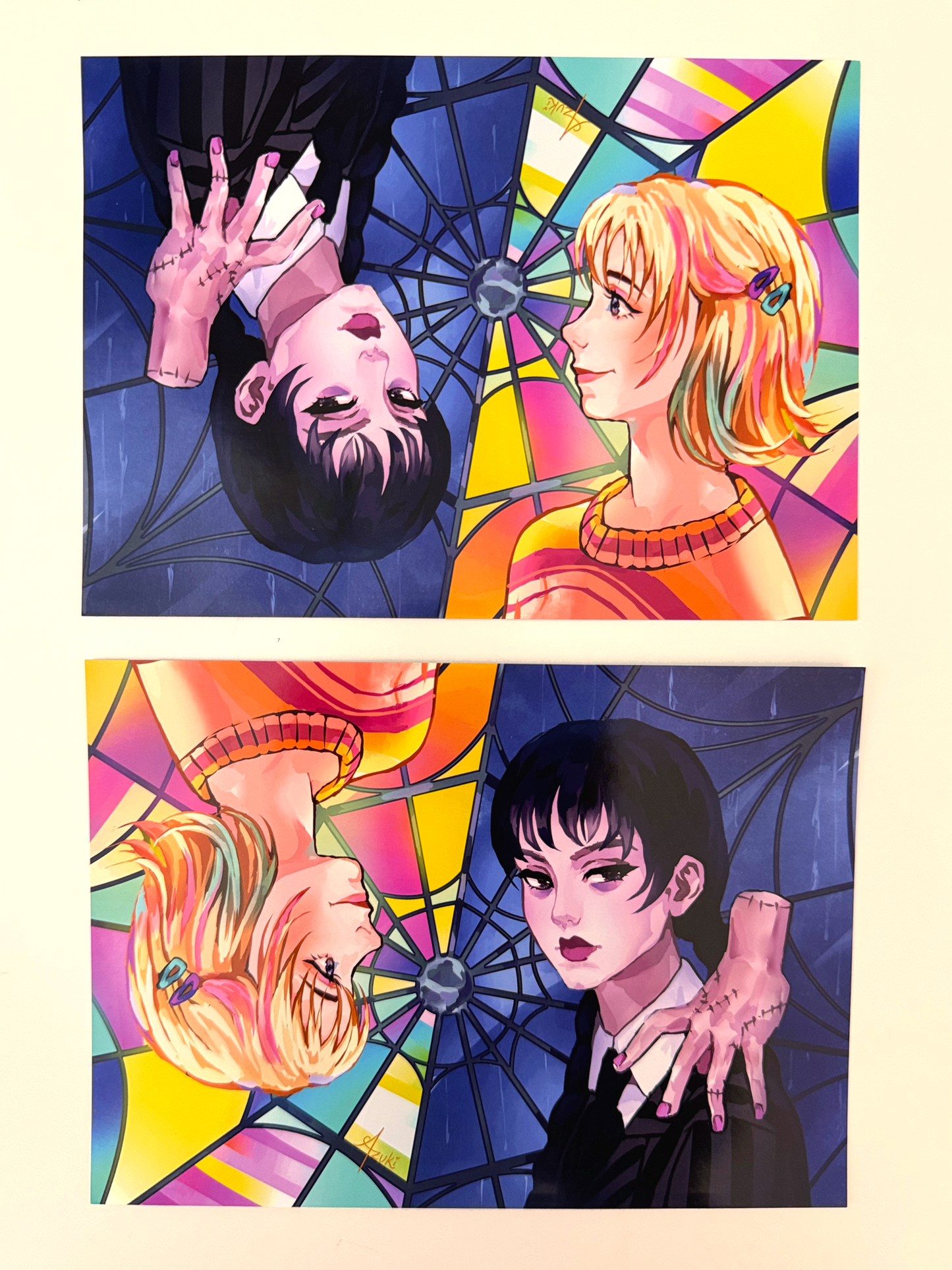 The Wednesday and Enid print can be shown on either side.