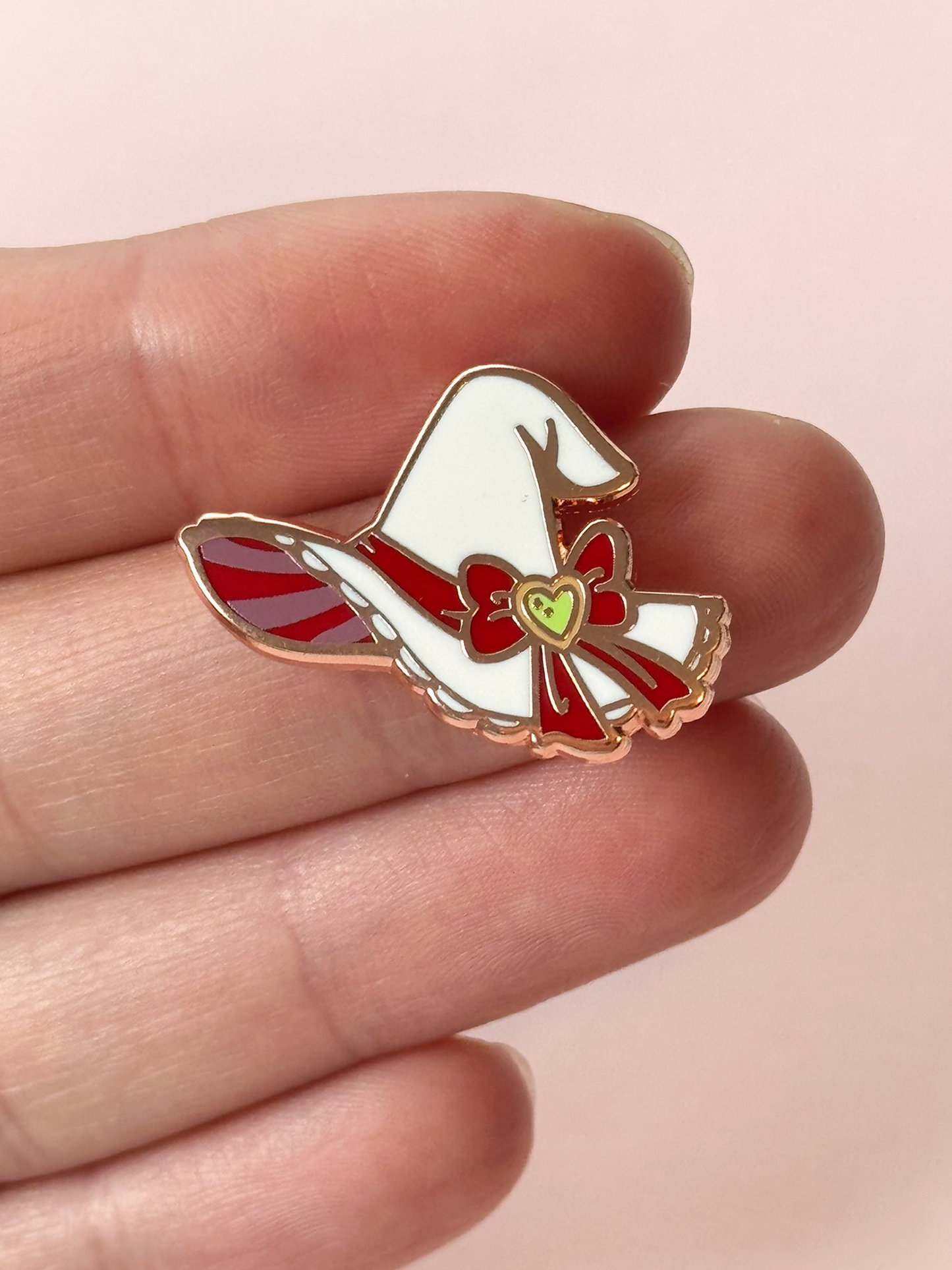 The witc hat pin held in hand