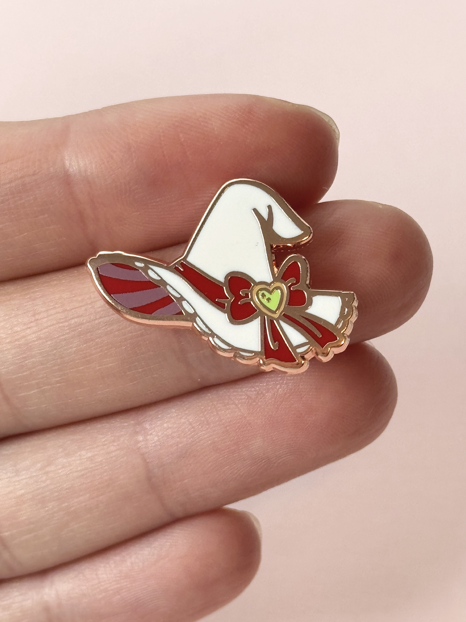 The witc hat pin held in hand