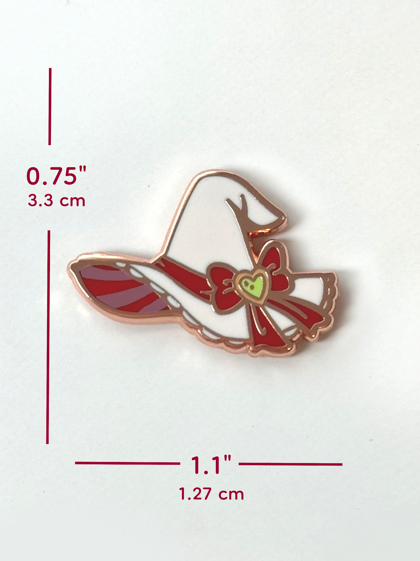 The witch hat pin measures 0.75 inches tall and 1.1 inches wide