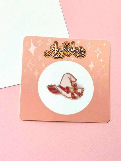 The witch hat pin with its backing card